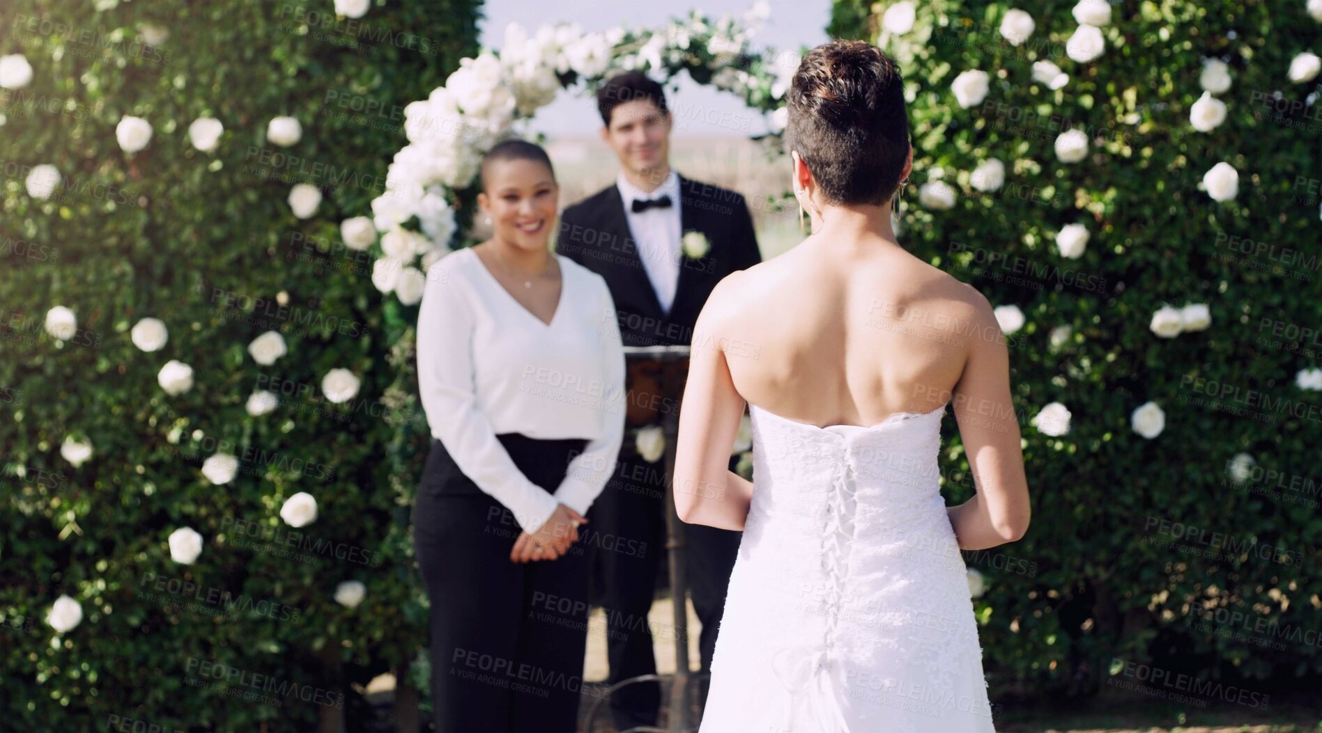 Buy stock photo Rearview shot of an unrecognizable lesbian bride walking towards the altar on her wedding day
