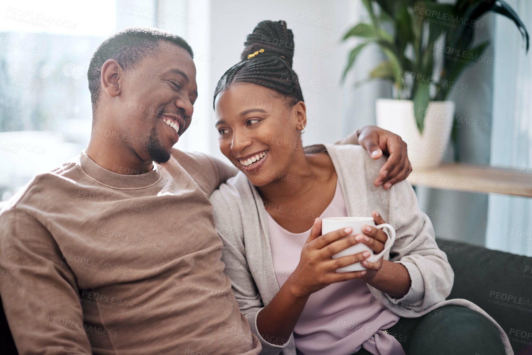 Buy stock photo Coffee, relax and black couple on sofa in home living room, bonding and talking. Love, tea and romantic man and woman speaking, discussion or conversation on couch in lounge or enjoying time together