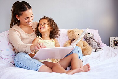 Buy stock photo Happy, book and mother with daughter in bedroom for storytelling, fantasy or creative. Education, learning and love with woman reading to young girl in family home for fairytale, literature and relax