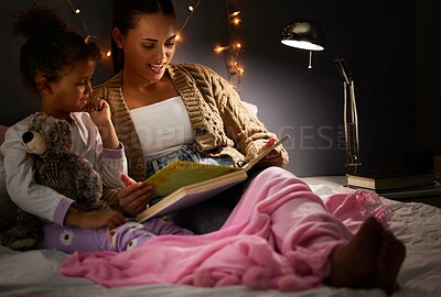 Buy stock photo Night, book and reading with mother and daughter in bedroom for creative storytelling, fantasy and home. Books, learning and love with woman, happy girl and family at bedtime, literature and relax