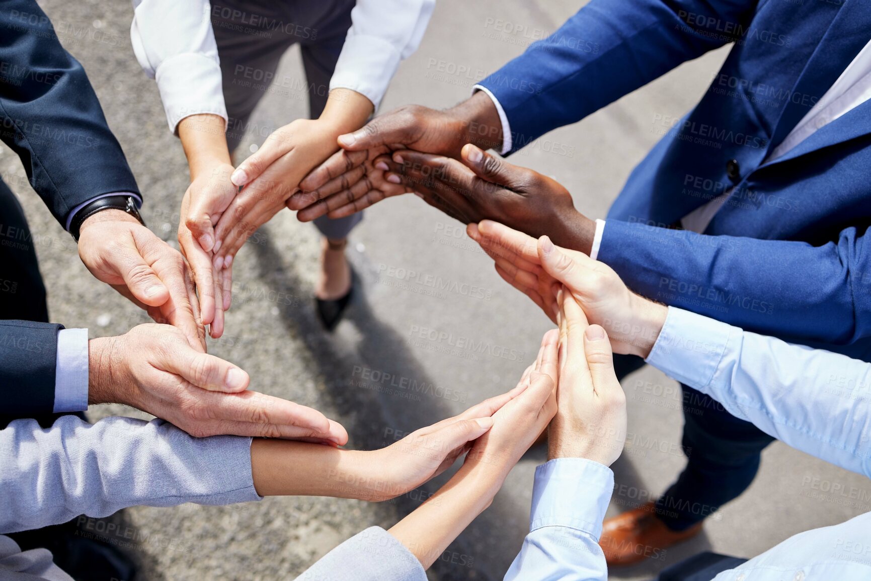 Buy stock photo .Shot of a group of unrecognizable businesspeople forming a circle with their hands outside