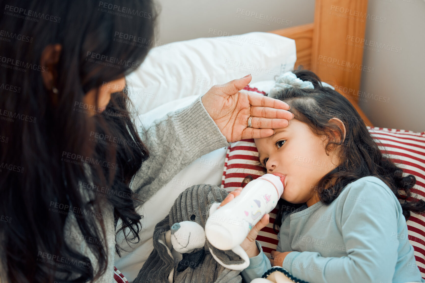 Buy stock photo Mother, sick and fever with girl drinking milk from bottle in bedroom of home for rest or recovery. Family, children and woman parent with tired daughter in bed to relax at apartment for hydration