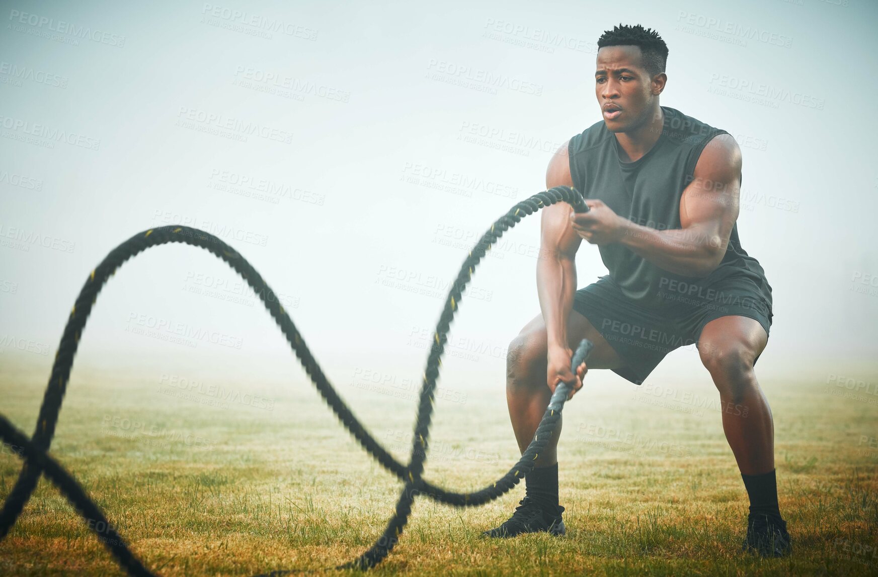 Buy stock photo Fitness, battle rope and man on field for power workout for body building, training and muscle strength. Exercise, sports and bodybuilder on grass with ropes, energy and outdoor performance challenge
