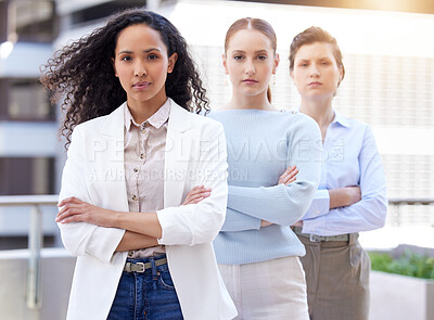 Buy stock photo Crossed arms, serious and portrait of business women in city for collaboration, diversity and unity. Confident, leader and group of professional female creative designers with teamwork in urban town.