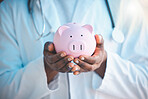 Doctor, financial or hands of person with piggy bank for funding opportunity, planning or savings investment. Closeup, loan help or income budget for future safety, medical aid or insurance security