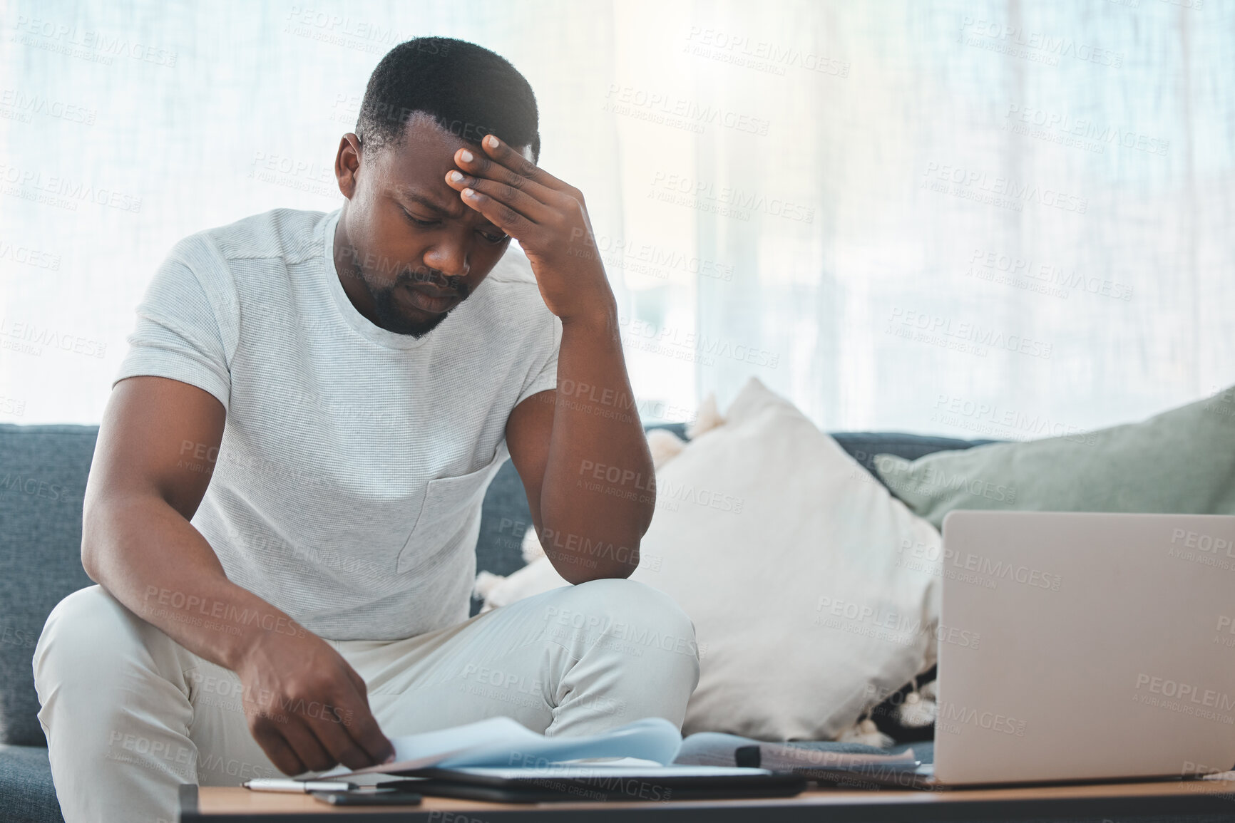 Buy stock photo Stress, debt or black man with documents or laptop in home for budget, planning savings or anxiety. Financial crisis, bills or frustrated African person checking invoice, payment or balance paperwork