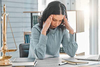 Buy stock photo Woman, lawyer and headache from stress in office, burnout and worry for legal constitution or justice. Female person, migraine and laptop for research on court case, anxiety and advocate for solution