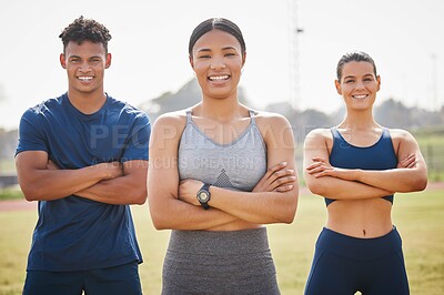 Buy stock photo Cropped portrait of three young athletes standing outside with their arms folded