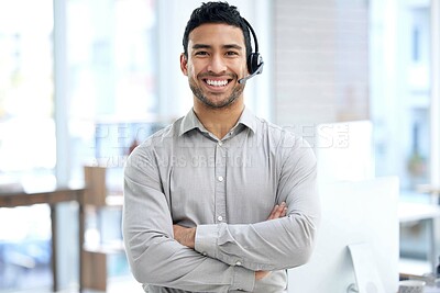 Buy stock photo Portrait of a young businessman using a headset in a modern office