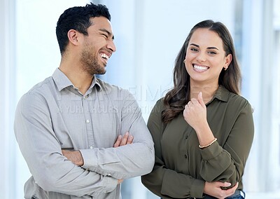 Buy stock photo Portrait of a young businessman and businesswoman working together in a modern office