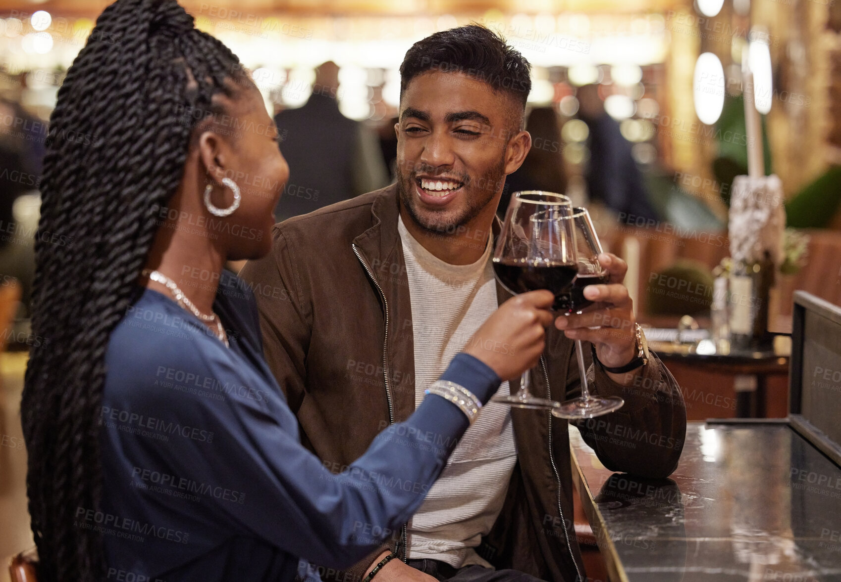 Buy stock photo Couple, wine and cheers in nightclub with celebration for anniversary date, support or birthday event or happy. Interracial, woman and man with alcohol toast for promotion, success and smile in pub