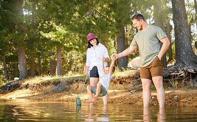 Buy stock photo Family, son and lake with playing in forest for adventure with jump with laughing on weekend. Nature, woods and parents with kid or water for travel with quality time in summer for camping with fun.