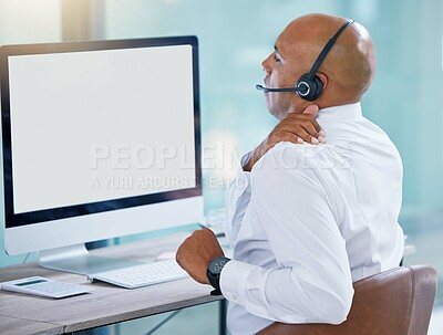 Buy stock photo Stressed, back pain call center agent stretching bad, strained or sore muscle while working on computer. Behind of tired sales rep or support consultant working overtime or sitting long hours at desk