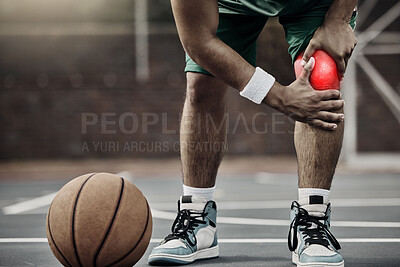 Buy stock photo Sports, injury in basketball and knee pain or athlete man while on an outdoors court holding his hurt leg during training or exercise for hobby. Closeup of male hands on glowing red body part