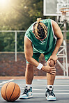Basketball injury, sports muscle and man with medical emergency during sport game on court. Professional athlete with pain after knee accident during training for competition, event or fitness match