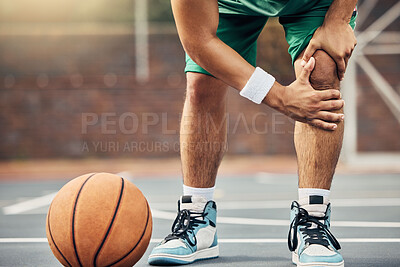 Buy stock photo Basketball, athlete and knee injury on the basketball court during outdoor game or training. Man in with leg pain after sports accident with a broken joint, inflammation or muscle tear during match.