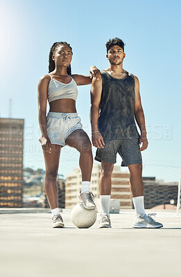 Buy stock photo Fitness, football and exercise couple with motivation, workout and sports training in the city. Man and woman athlete with soccer ball after a practice game in a urban town with a blue sky background