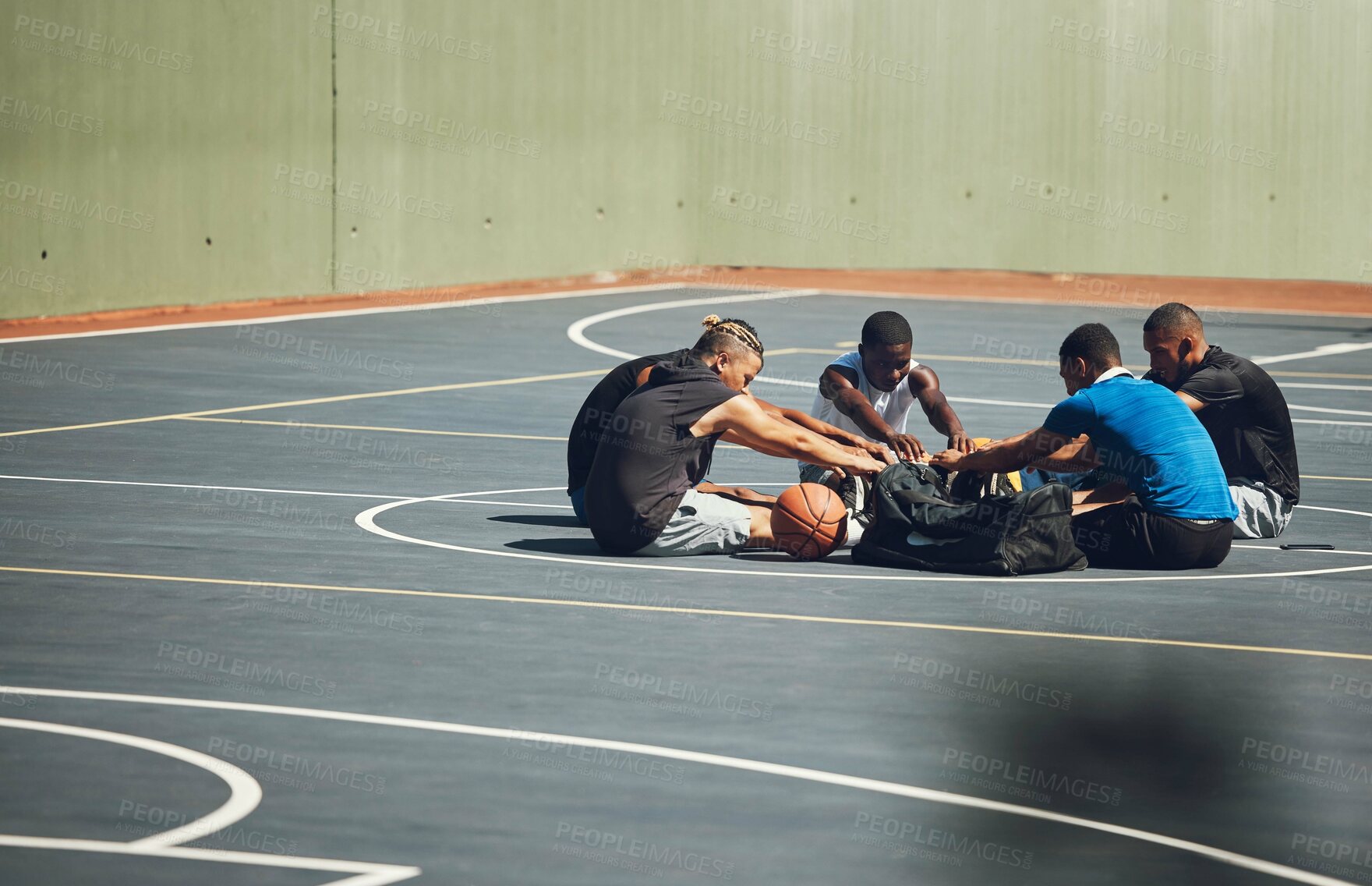 Buy stock photo Basketball, team and stretching on sports court to warm up for training, cardio exercise and workout outdoors in Atlanta. Fitness, teamwork and healthy athletes ready to start exercising or practice