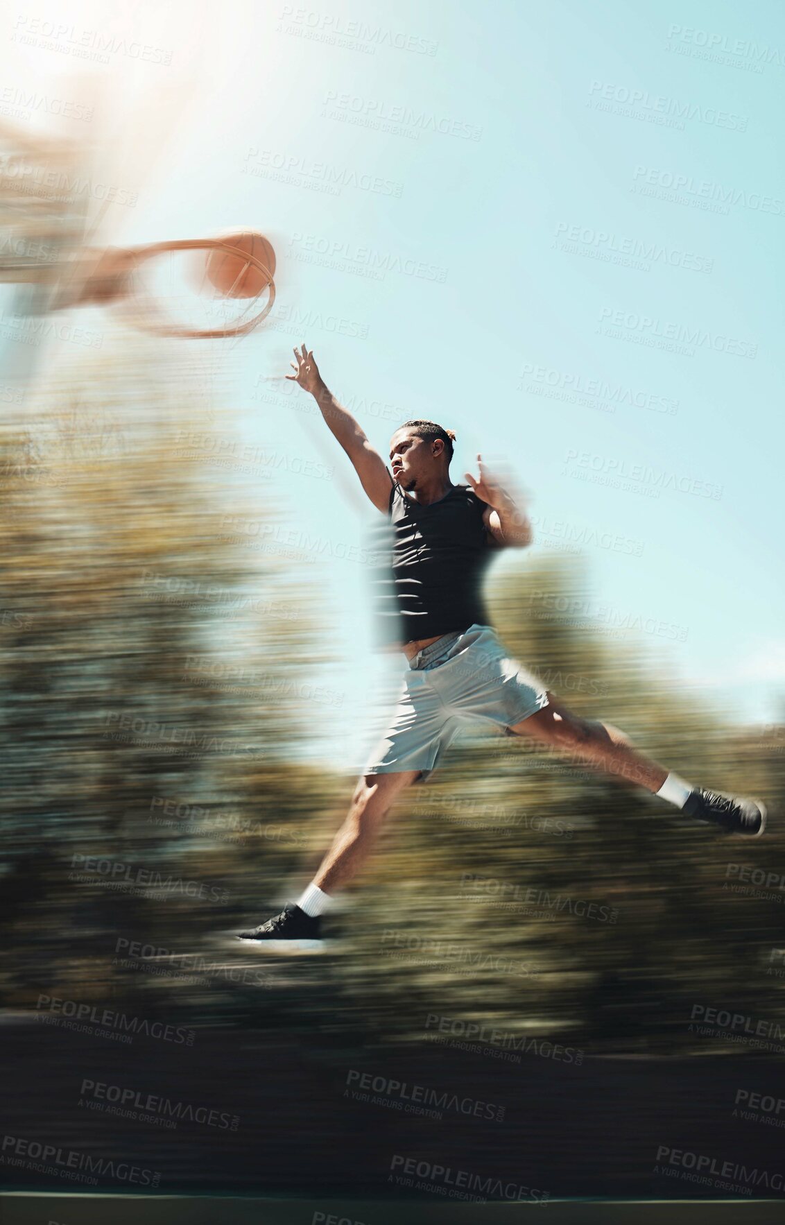 Buy stock photo Basketball, sports and goals with man and jump in park court training for fitness, health and workout. Energy, action and exercise with athlete in playing game for competition, wellness and winning