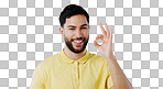 Ok, hands and portrait of man in studio for vote, certified review or feedback on white background. Happy indian model show emoji for success, agreement and icon of support, yes or sign of excellence