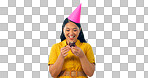 Birthday party, chocolate and an asian woman eating a cupcake in studio isolated on a transparent background for celebration. Smile, hat and a happy young person with a dessert or snack at an event