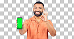 Man, portrait and ok for phone with green screen, space or agreement in studio on white background. Happy model, smartphone or yes emoji for certified newsletter, promotion or advertising information