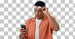Man, cellphone and shock texting gossip or social media search, internet rumor or surprise communication. Male person, mobile and glasses for secret message, blue studio background as mockup space