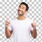 Handsome young mixed race man pointing towards copyspace while standing in studio isolated against a blue background. Happy hispanic male advertising or endorsing your product, company or idea