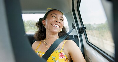 Woman, car and road trip with laugh by window with thinking, ideas and comic memory for vacation travel. Girl, person and happy in vehicle with smile to remember funny story with driving on road