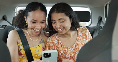 Woman, friends and phone on road trip with laugh, meme or smile with funny video, adventure or car. Girl, together and reading with blog, journey or holiday with comic video on web in transportation