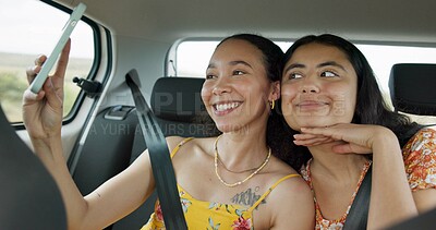 Woman, friends and selfie on road trip with smile, tongue and funny face with adventure in car. Girl, photography and kiss with care, journey or holiday with memory, profile picture or transportation