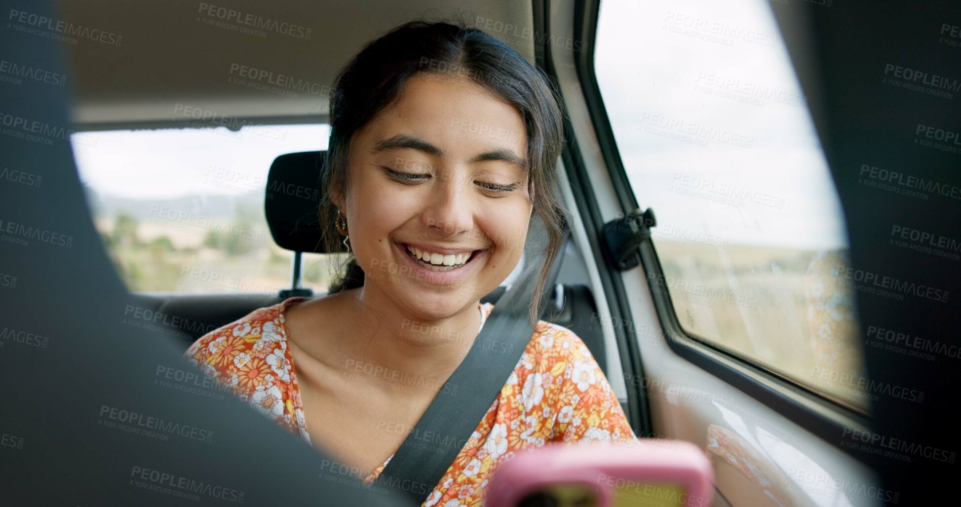 Buy stock photo Woman, phone and road trip in car with laugh, meme and comic video on internet on road for travel. Girl, smartphone and reading in vehicle with funny blog, social media post or story with transport