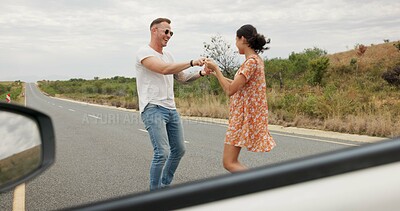 Nature, dancing and young couple on road trip in countryside listening to music together. Happy, love and man and woman moving to song, playlist or radio by car on vacation, adventure or holiday.