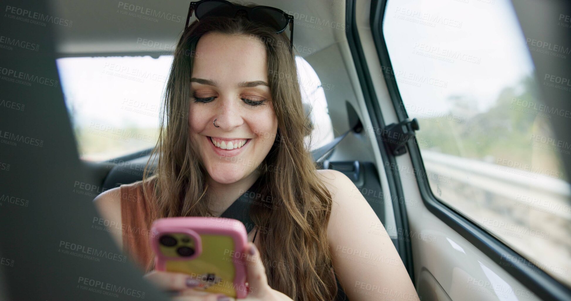 Buy stock photo Happy woman, phone and social media in car for travel, communication or networking in transportation. Female person smile on mobile smartphone in vehicle for online chatting, texting or road trip