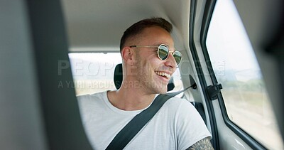 Happy man, car and sunglasses on road trip in backseat for travel, journey or adventure in the countryside. Male person smile in joy looking out vehicle window for natural scenery, holiday or weekend