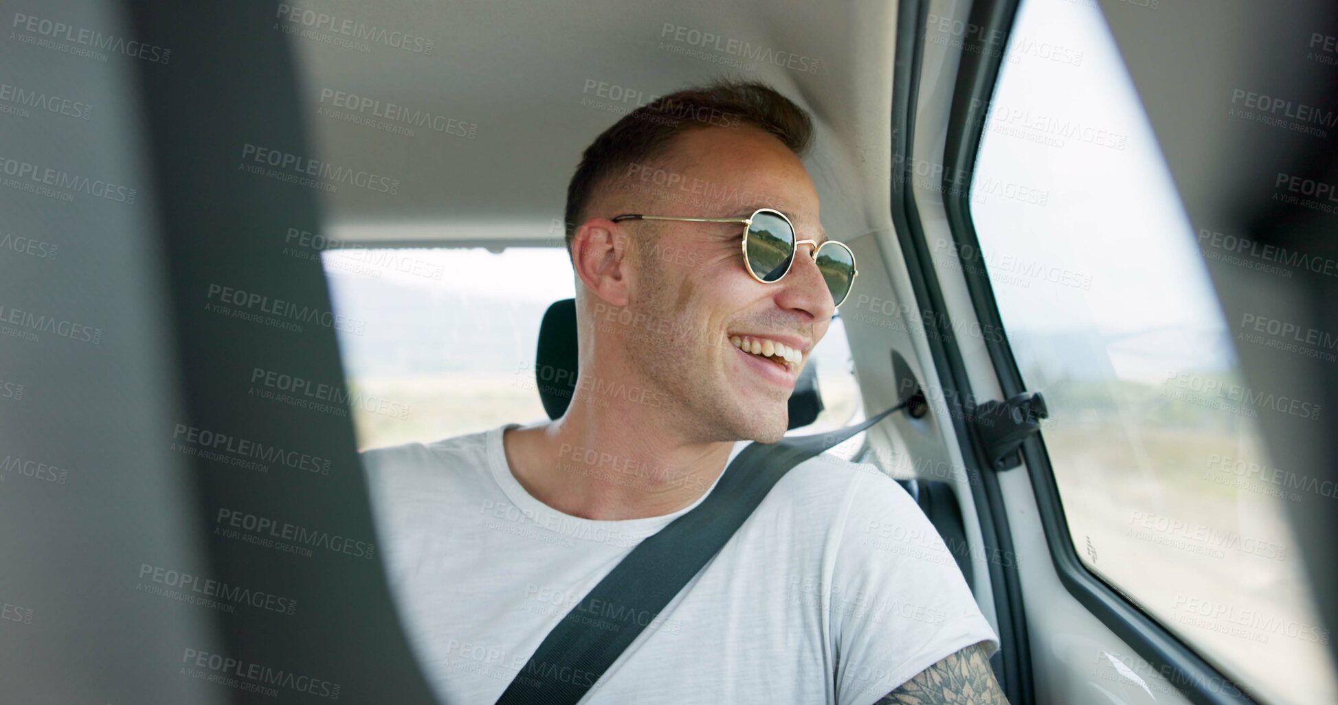 Buy stock photo Happy man, car and sunglasses on road trip in backseat for travel, journey or adventure in the countryside. Male person smile in joy looking out vehicle window for natural scenery, holiday or weekend