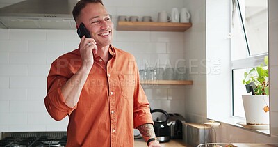 Man, kitchen and phone call or conversation at home, happy and relaxing in apartment. Male person, communication and mobile application for funny online conversation, humor and laughing on smartphone