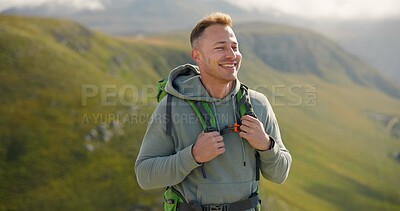 Happy man, face and backpack with mountain in nature for hiking, adventure or outdoor journey. Male person, tourist or hiker smile with bag for trekking, sightseeing or fresh air on cliff or hills