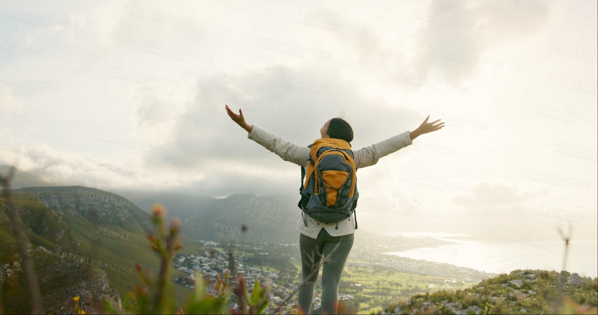 Buy stock photo Woman, mountain top and freedom or success for hiking goals, travel or trekking adventure in nature. Back of hiker or winner in backpack and arms up for celebration, achievement or excited on a cliff