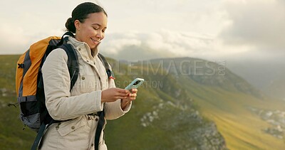 Woman hiking and travel on mountains with phone for social media update, location search and outdoor internet. Young influencer with backpack and mobile app for trekking results or progress on a hill
