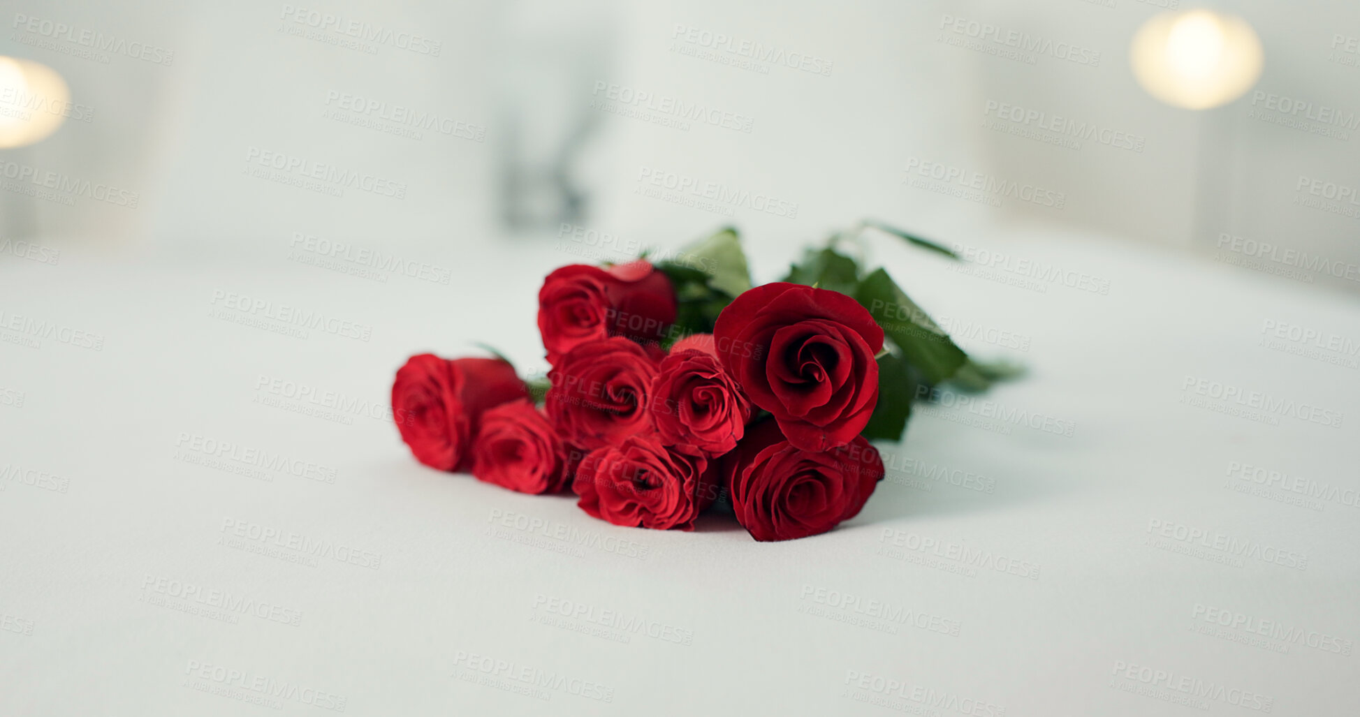 Buy stock photo Romance, flowers and roses in bedroom for love on valentines day, anniversary celebration and honeymoon. Red rose, bouquet and closeup of florals on bed for romantic date, occasion and luxury in home