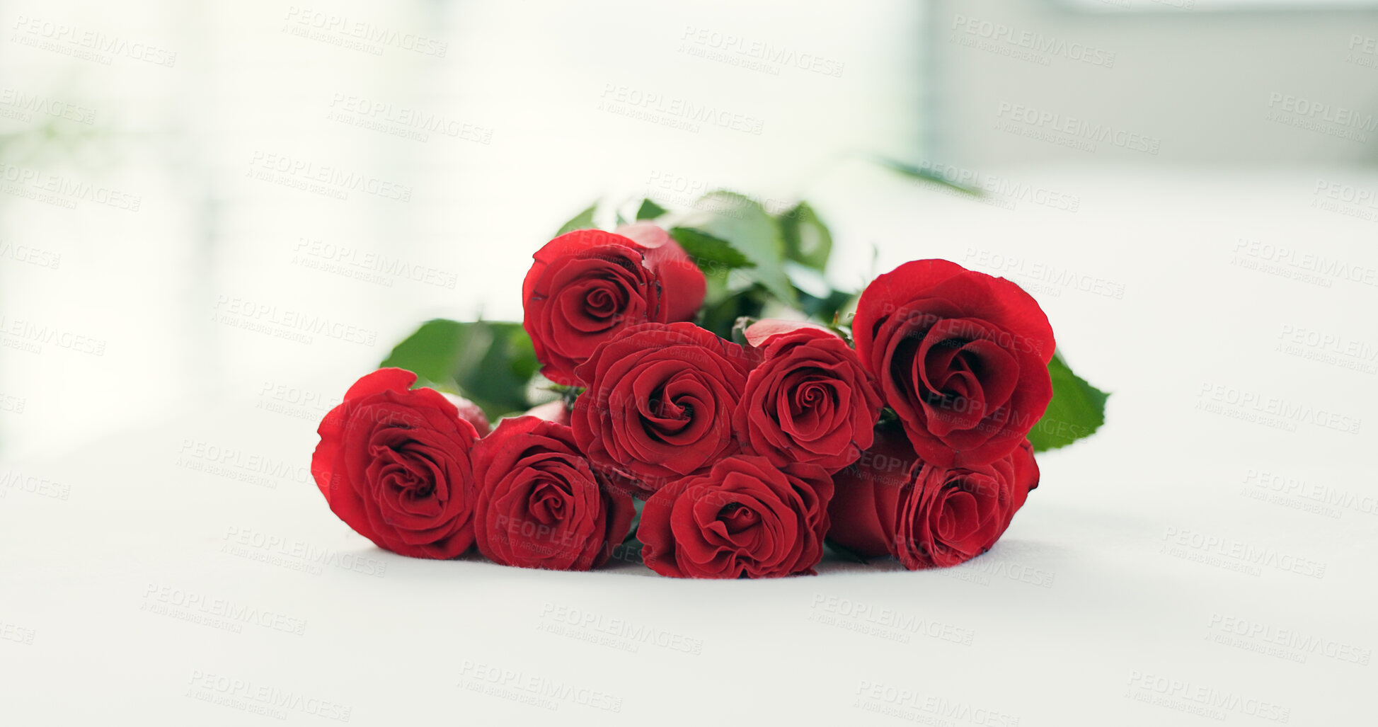 Buy stock photo Romance, flowers and roses on bed for love on valentines day, anniversary celebration and honeymoon. Red rose, bouquet and closeup of florals in bedroom for romantic date, occasion and luxury in home