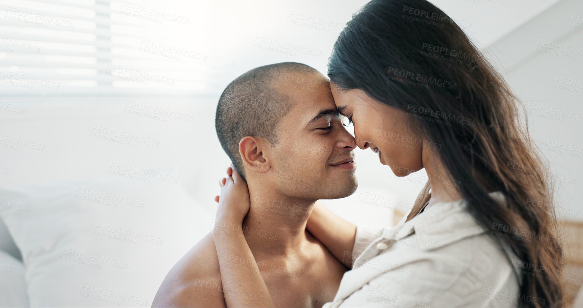 Buy stock photo Couple, hug in bed and smile for love and commitment, talking and forehead touch, romance and chemistry. People in relationship, bonding and care at home, communication or trust with peace and calm