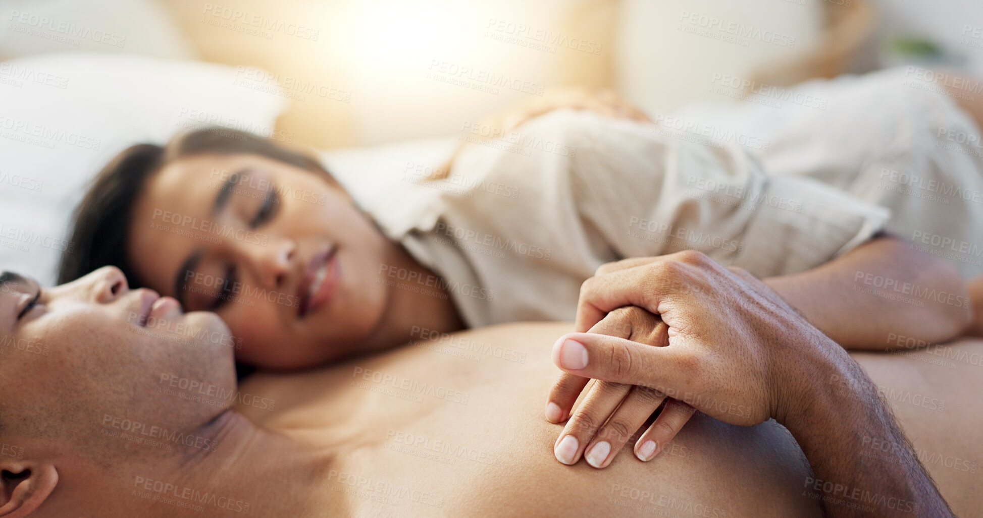 Buy stock photo Happy couple, relax and hug on bed for morning, romance or love in embrace, trust or care at home. Young man and woman smile lying in bedroom rest for intimacy, passion or bonding together at house