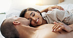 Happy couple, bed and talking of love, intimacy and romance at home for relationship and bonding. Young woman and man hug and relax in bedroom for marriage, kiss and wake up together in apartment