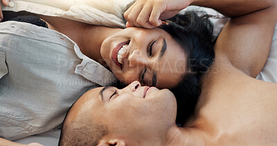 Happy couple, relax and bed for morning, romance or love in embrace, trust or care above at home. Young man and woman smile lying in bedroom rest for intimacy, passion or bonding together at house