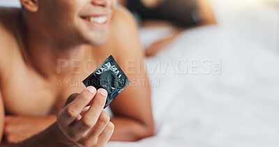 Man, condom and contraception for safety in bedroom, smile and proud for responsible choice at home. Couple, security and happy for protection in sex, rubber and prevention of hiv and sexual illness
