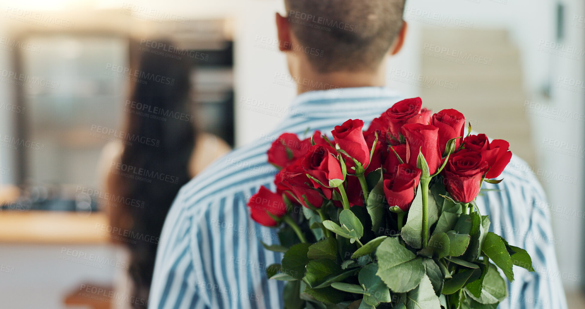 Buy stock photo Happy couple, red roses and kiss for surprise, anniversary or valentines day in kitchen at home. Face of young man and woman smile with flowers for romantic gift, love or care in celebration at house