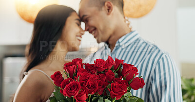 Couple, flowers and kiss for anniversary celebration, marriage and loyalty or commitment to love. People, happy and romance for relationship milestone, bonding and plant gift for support at home