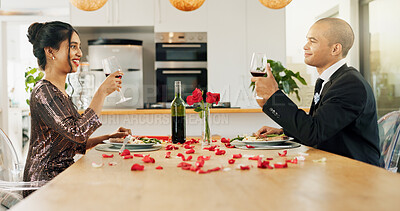 Couple, home and toast with red wine for celebration of love, romance and valentines day on their anniversary. Happy man and woman on date with glasses, drinks and red champagne for success or luxury